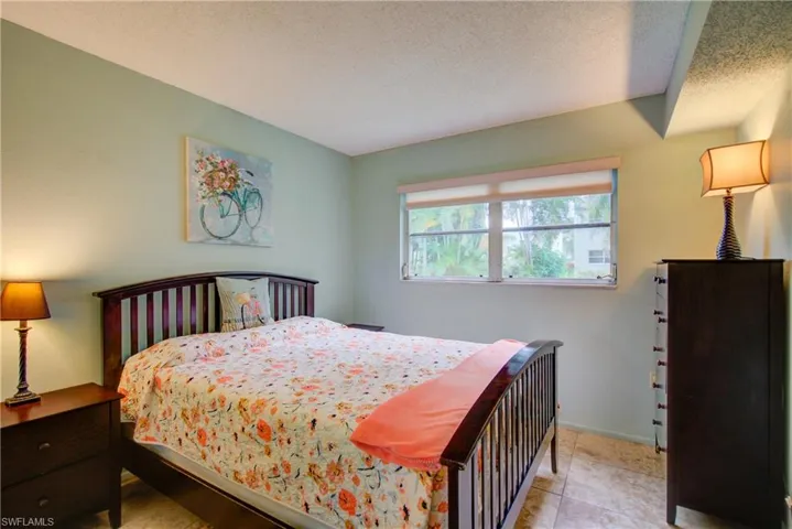 The guest bedroom with a large window