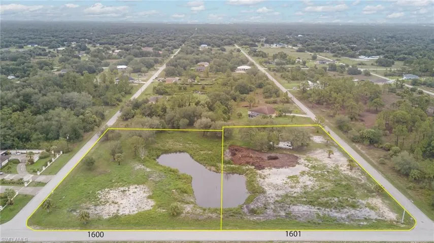 Aerial overview of property's location with property boundaries highlighted and a nearby body of water