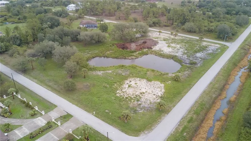 Aerial overview of property's location with a nearby body of water