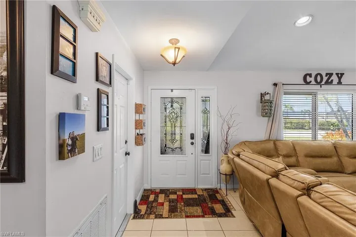 Entrance foyer featuring light tile patterned flooring, visible vents, and recessed lighting