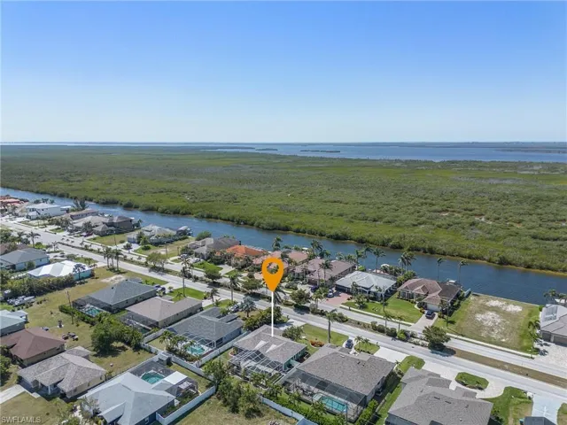 Drone / aerial view featuring a residential view and a water view