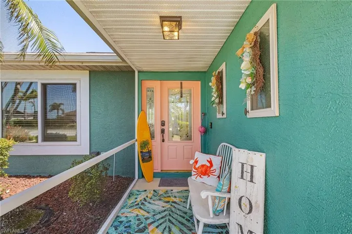 View of exterior entry with stucco siding
