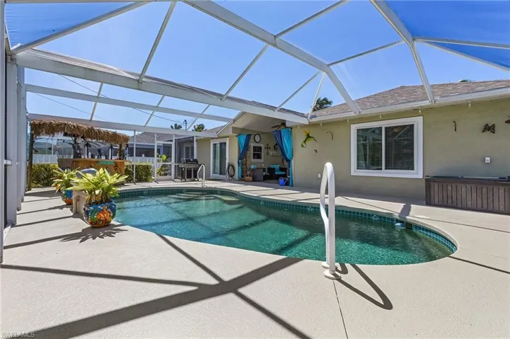 Pool with a lanai and a patio area