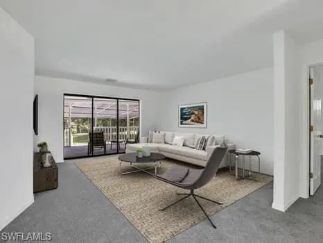 Living room featuring carpet floors