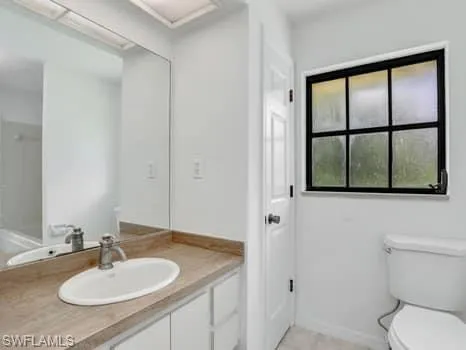 Bathroom featuring toilet and vanity