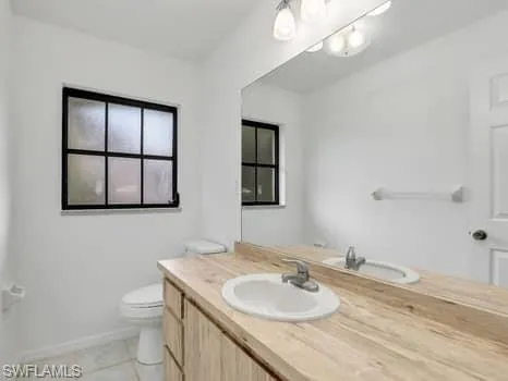 Bathroom with vanity and light tile patterned floors