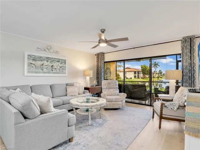 Living area with a ceiling fan and plenty of natural light