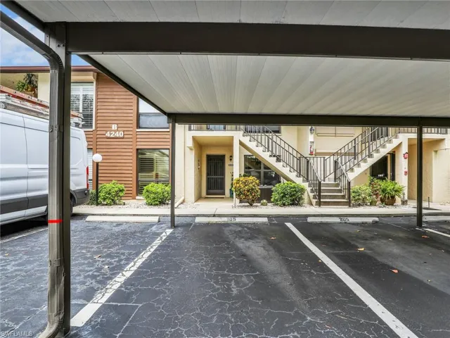 Covered carport in front of home's entry