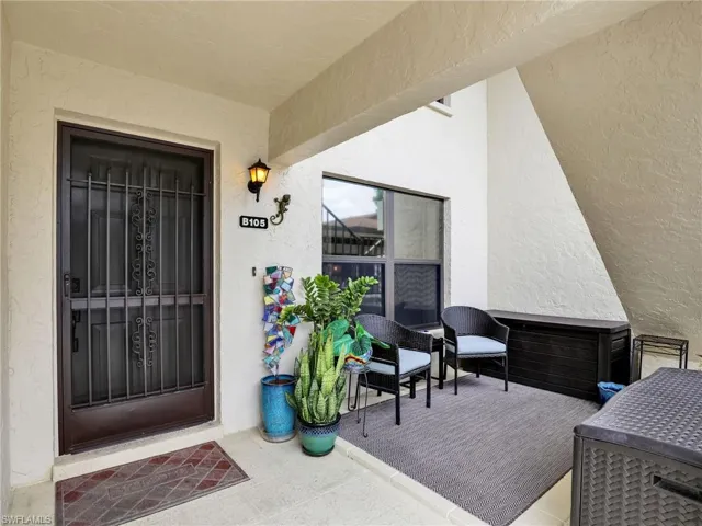 Property entrance with eastern exposure sitting area. Great area the greet neighbors heading to the pool.