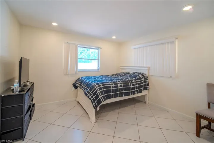 2nd Bedroom spacious room featuring light-colored walls and large format tile flooring
