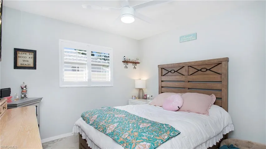 Bedroom with carpet and ceiling fan