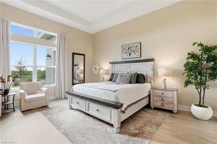 Bedroom featuring baseboards and light wood-type flooring