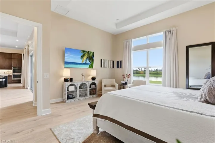 Bedroom with light wood-type flooring and recessed lighting