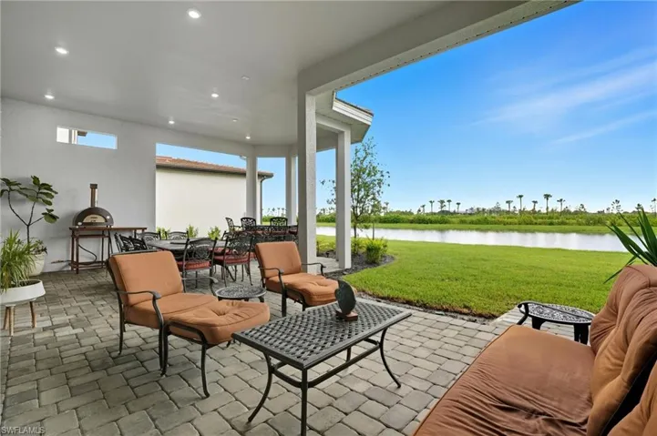 View of patio / terrace with outdoor dining area and a water view