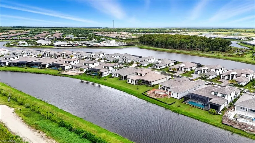 Aerial view of residential area with a large body of water