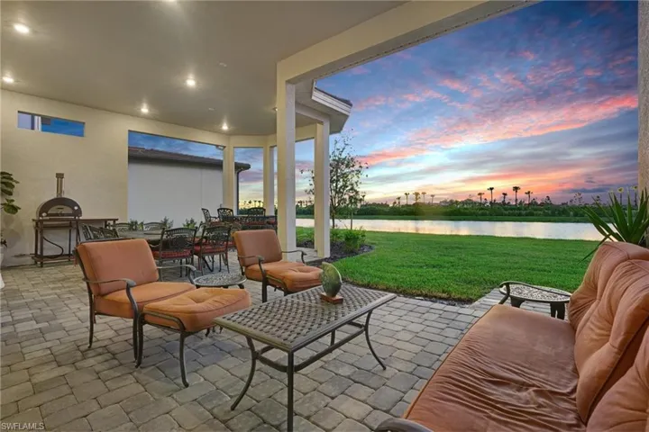 View of patio / terrace with a water view and outdoor dining area