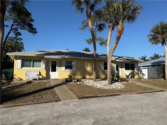 Ranch-style house with stucco siding