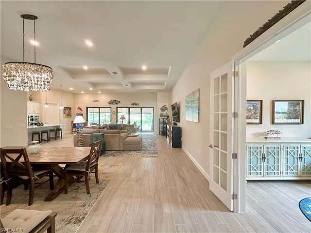 Open floor plan with French doors leading to the den
