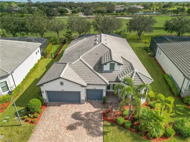 Birds eye view of your new home with brick paver driveway