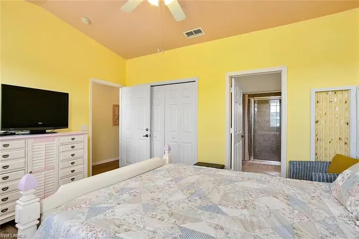 Bedroom featuring ceiling fan and a closet