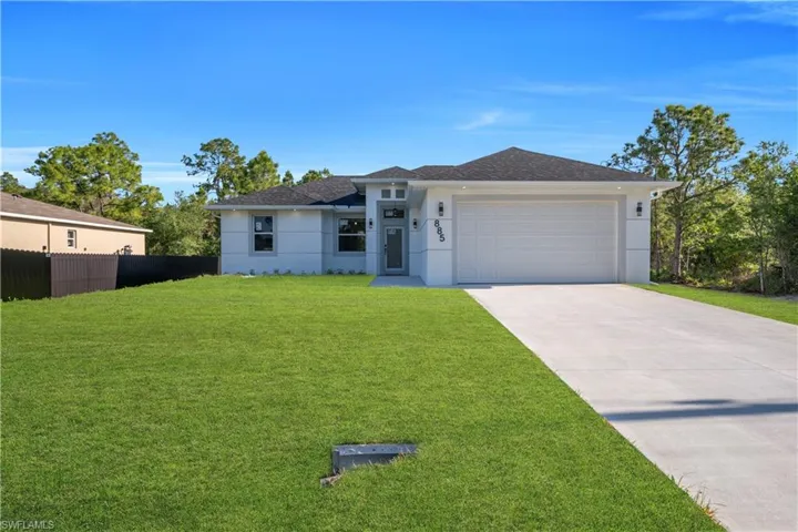 Contemporary single-story stucco exterior with a dark shingle roof
