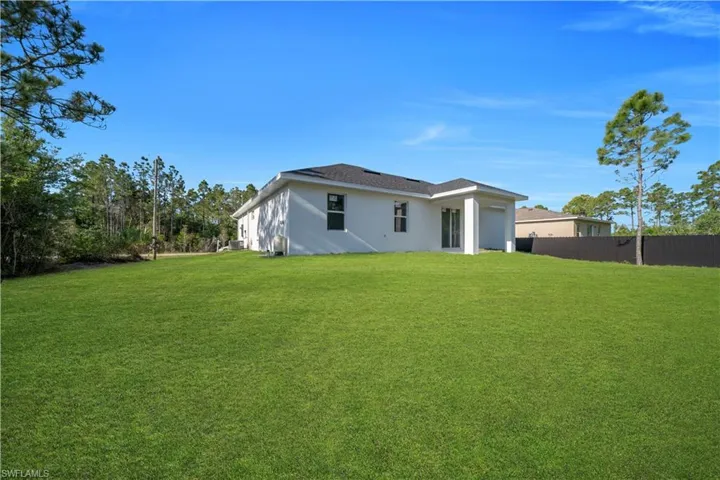 Expansive green lawn providing ample outdoor space