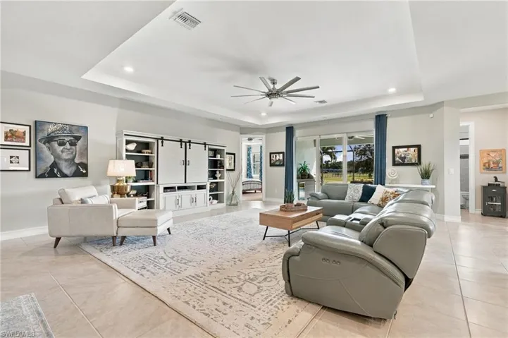 Tray ceiling 10' featuring a recessed design enhances the open concept living space