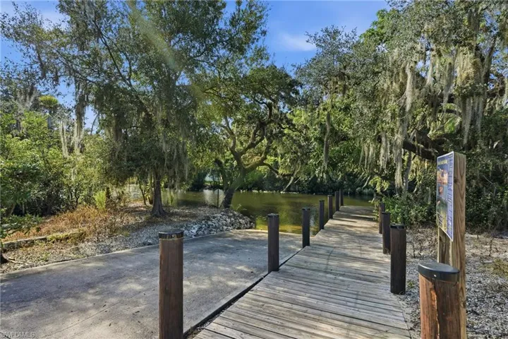 Private boat access on Hickey Creek with access to the Caloosahatchee River just a few minutes away - concrete ramp featuring a dock and dedicated  parking area