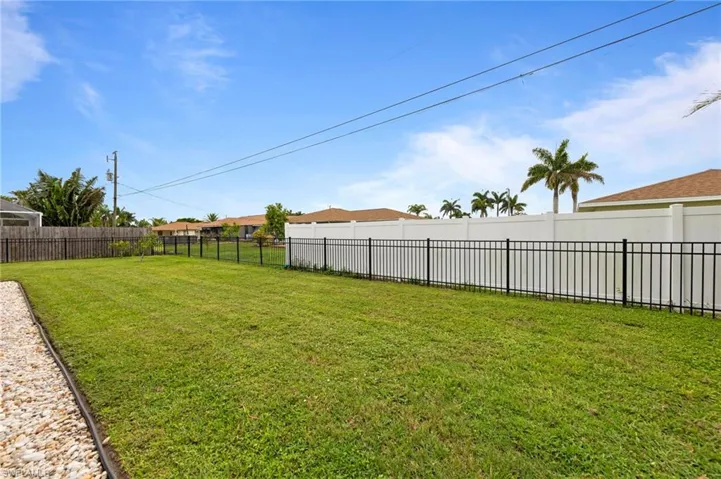 View of fenced backyard
