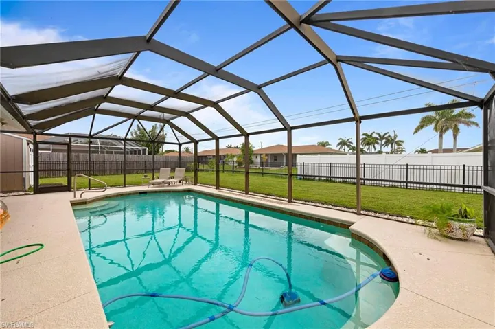 View of pool featuring a patio and a lanai