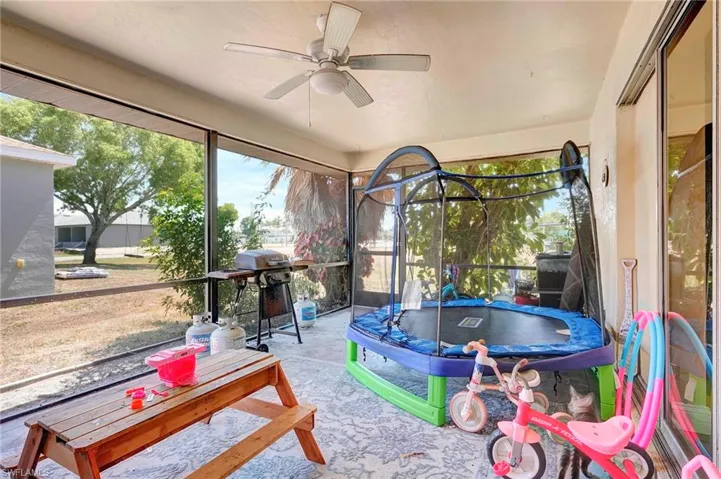 Sunroom featuring ceiling fan