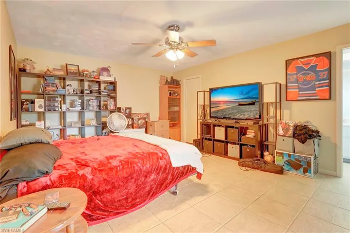 Tiled bedroom with ceiling fan
