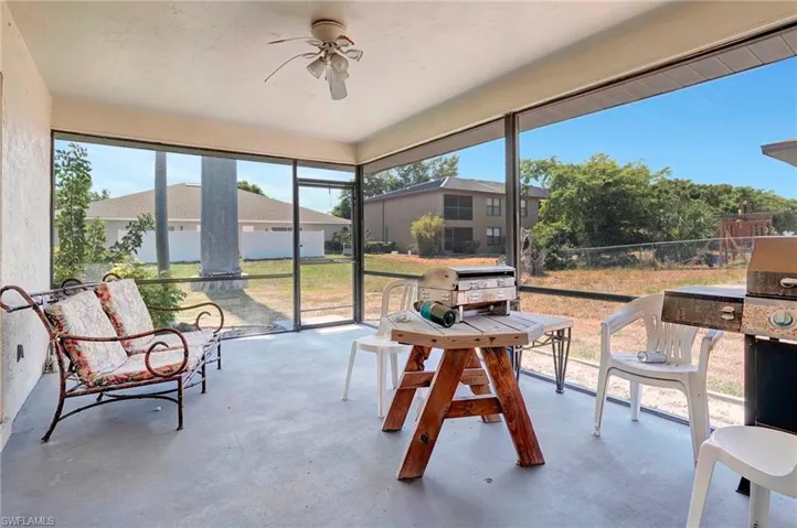 Sunroom featuring ceiling fan
