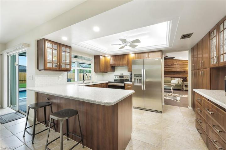 Bright, spacious kitchen with stainless steel appliances