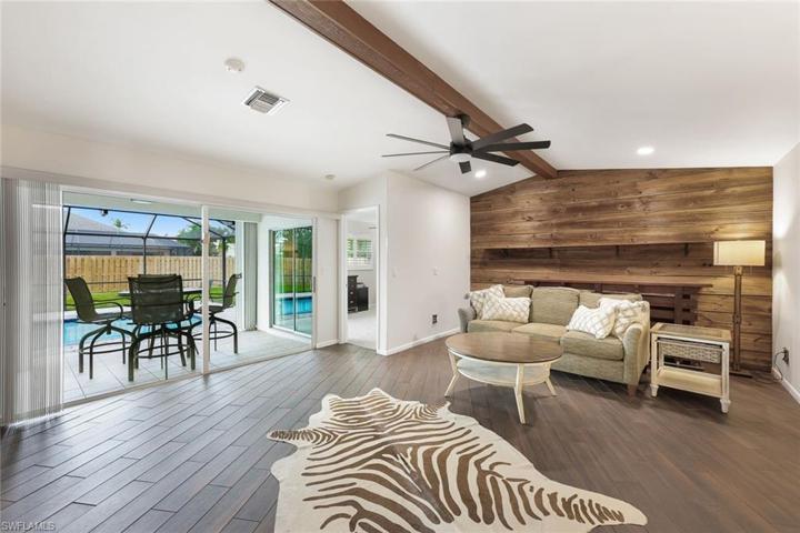 Spacious living room opens up to the pool/lanai area