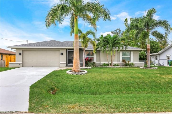 Front Elevation with beautiful landscaping!