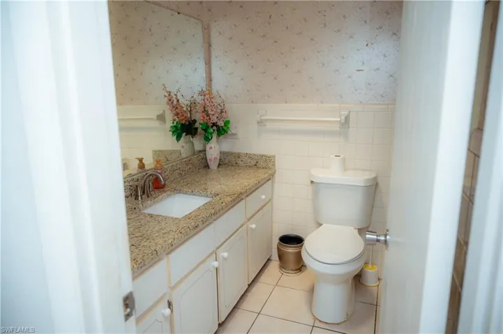 Bathroom featuring a vanity with a light-toned countertop and an integrated sink