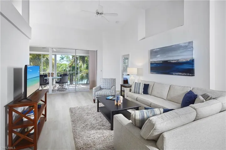 Fall in love with this Lake Harbor Court home with vaulted ceilings overlooking the lake!
