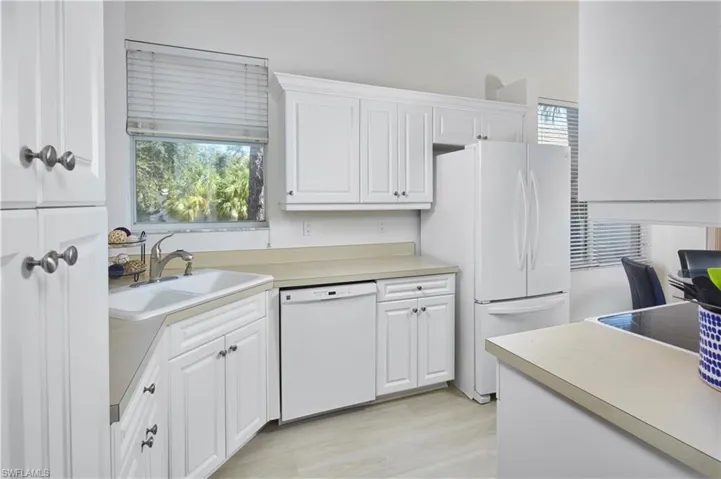 Ample counter space and conveniently located within the home. There is plenty of room in this kitchen for two!