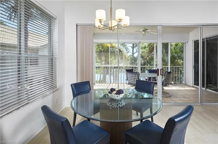 The dining area with a gorgeous lake view allows easy access to the lanai.