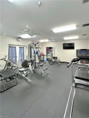Exercise room with a ceiling fan