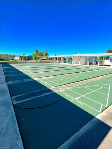 View of home's community with shuffleboard