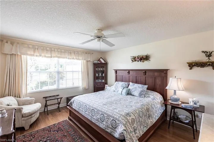 Huge master bedroom has room for large furniture pieces.