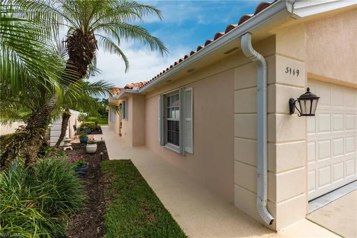 Side entry with privacy wall between neighbors.