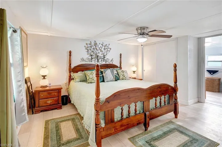 Bedroom with wood finished floors and ceiling fan