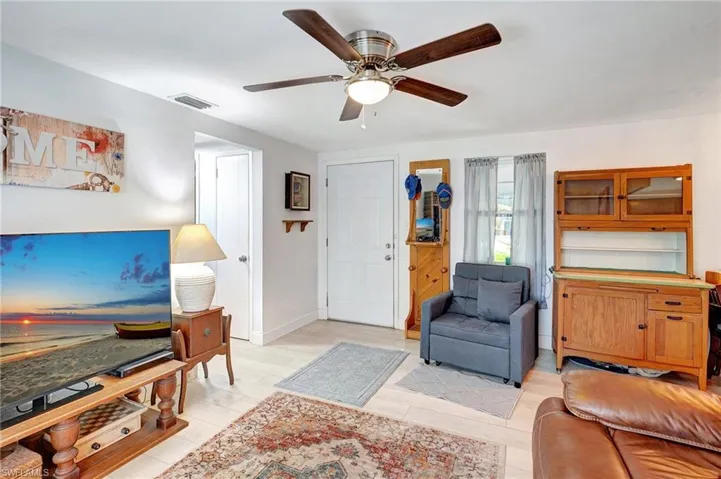 Living area featuring ceiling fan