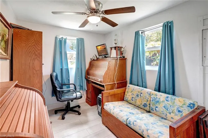 Home office featuring plenty of natural light and ceiling fan