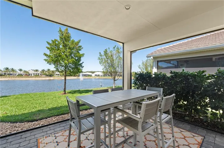 View of patio featuring a water view and outdoor dining space