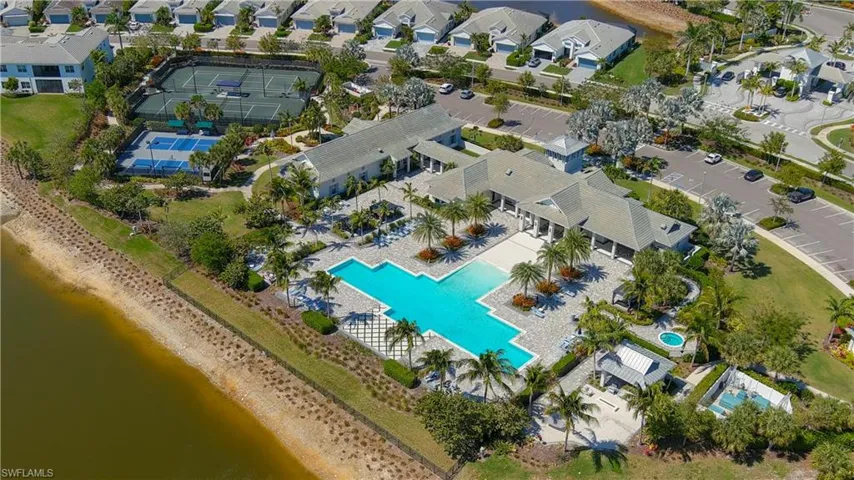 View of property location featuring a large body of water and nearby suburban area