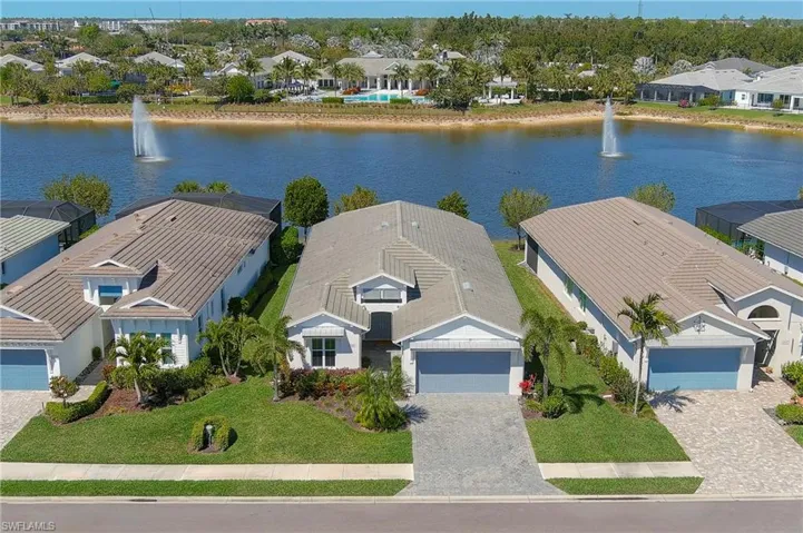 Aerial perspective of suburban area with a large body of water